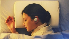 A sleeping person wearing the Breeze earphone, LG Electronics' latest sleep care offering