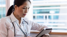 Healthcare provider looking at a tablet