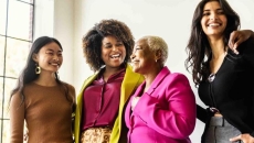 Group of friends standing together and laughing