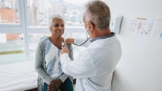 Doctor listening to a patients heart with a stethoscope