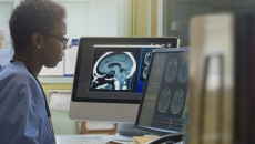 Healthcare professional examining an x-ray