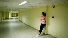 Person standing in the hall of a halfway house