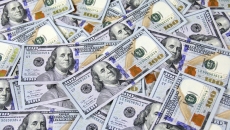 A pile of hundred dollar bills