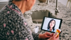 person looking at tablet screen