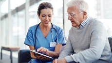 Heathcare professional consulting with patient.