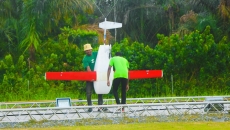 Two individuals preparing a done