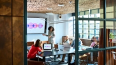 A woman presenting to potential investors