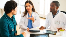 Doctors discussing imaging results.