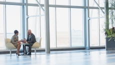 Two professionals meeting in an office.