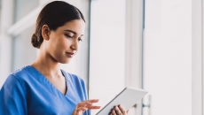 A nurse using a tablet