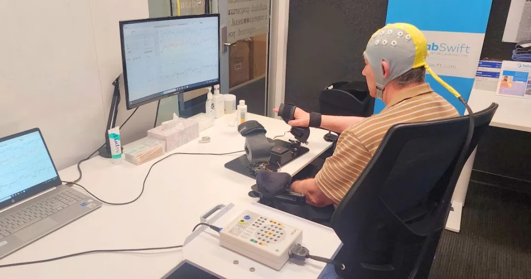 A post-stroke patient receiving brain-computer interface-based rehabilitation therapy