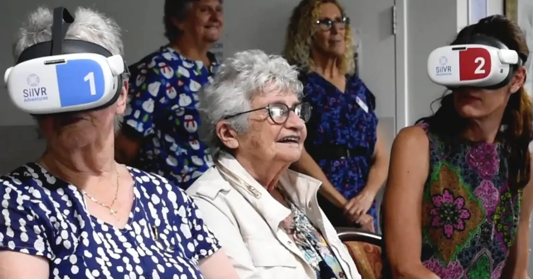 Aged care residents wearing VR headsets