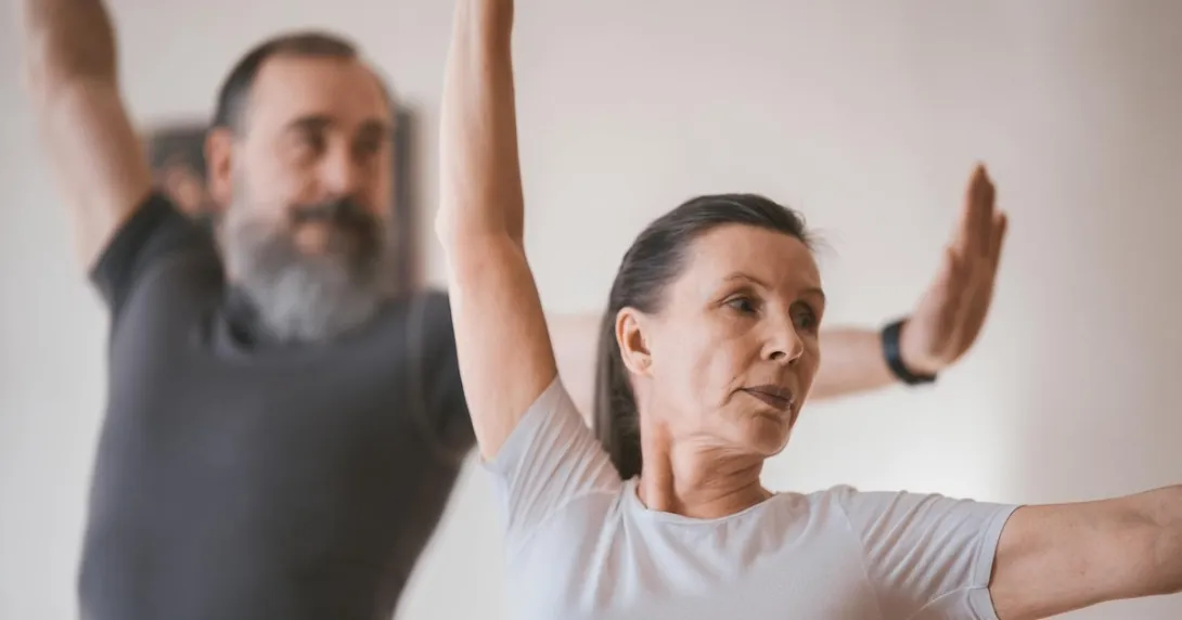 Two elderly people doing exercises