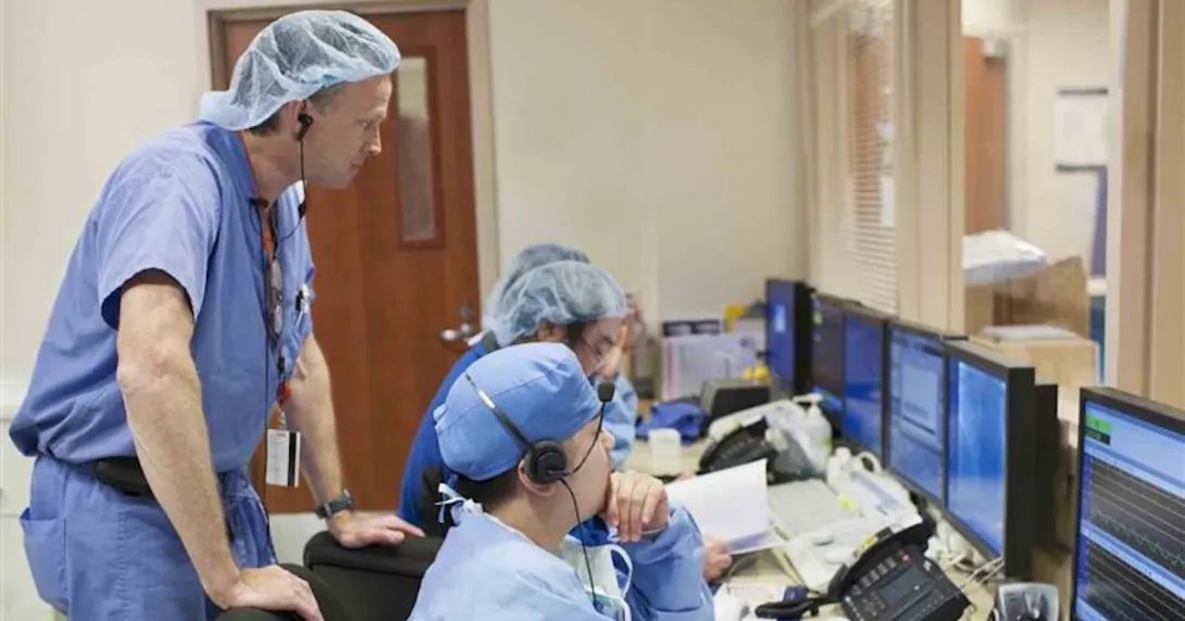 Healthcare workers looking at a computer