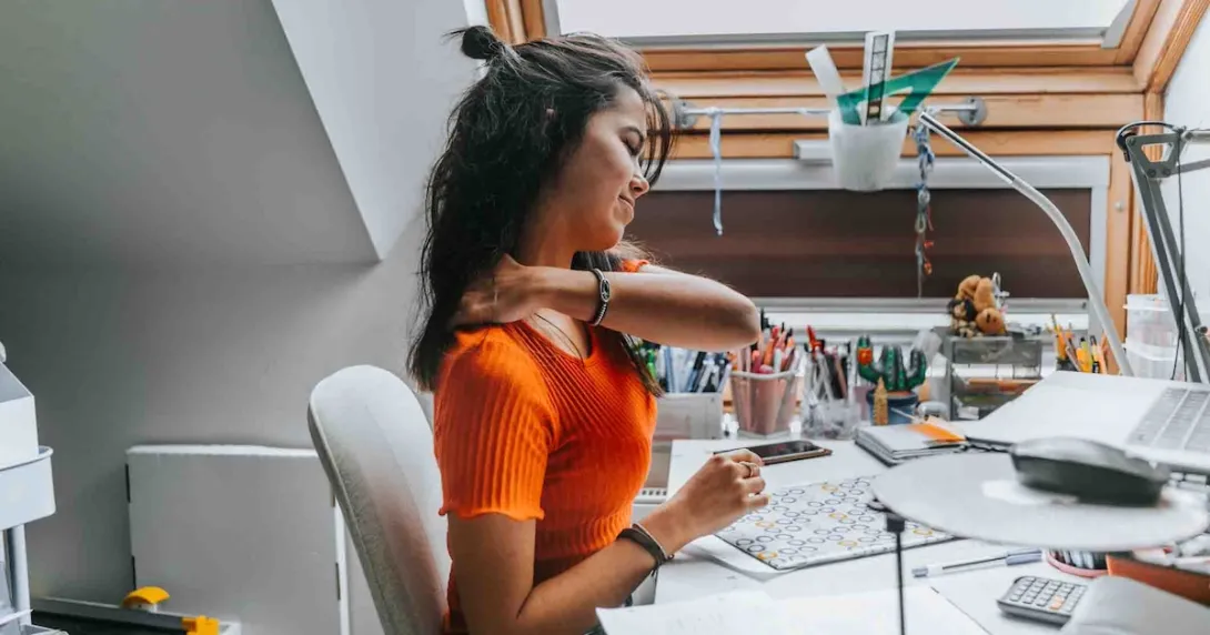 Person with neck pain sitting at a desk