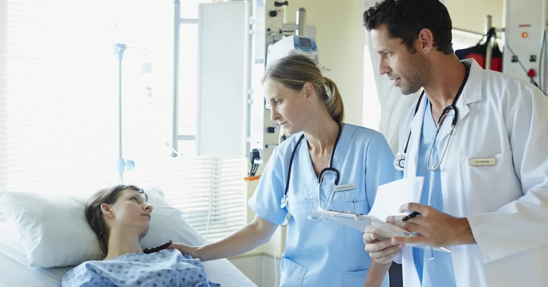 Healthcare professionals consulting with a patient