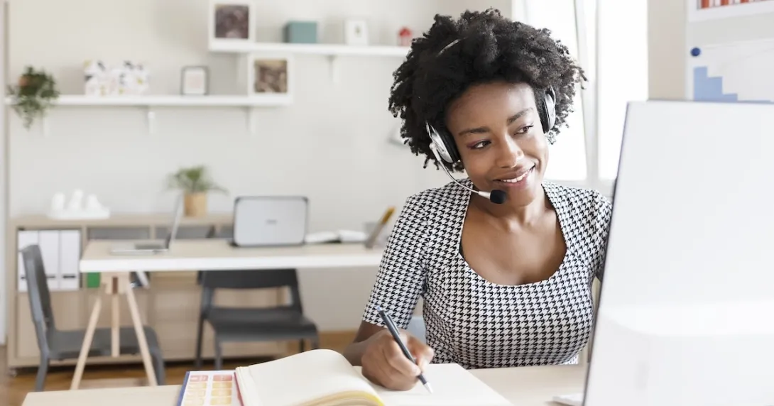 Healthcare worker engaging with someone via a PC
