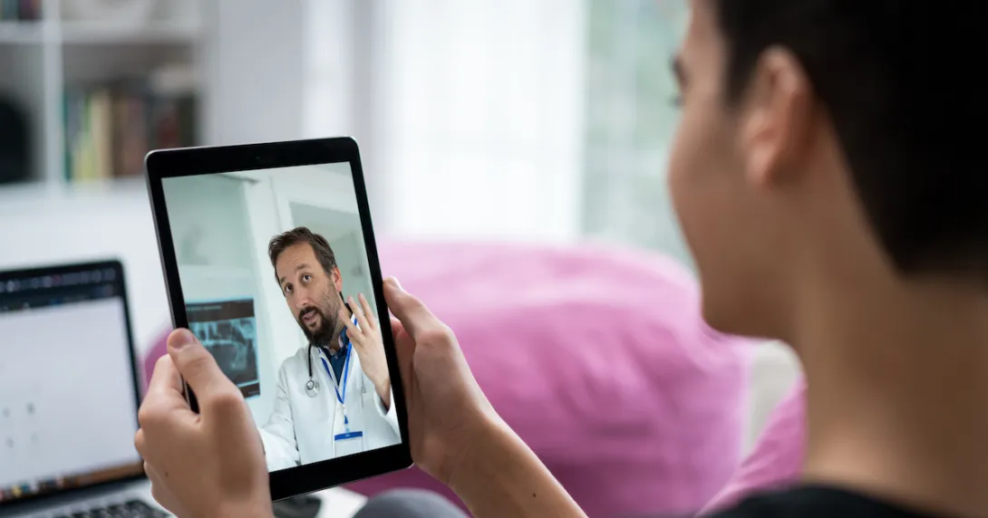 Person on a tablet speaking to a healthcare professional