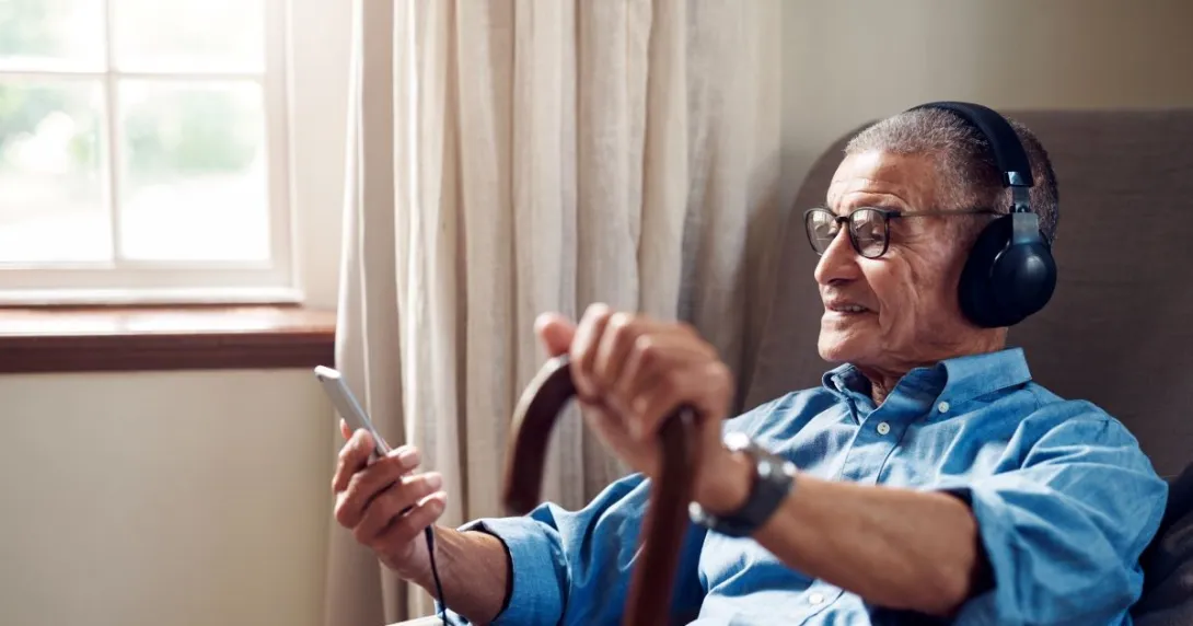 man in chair with cane