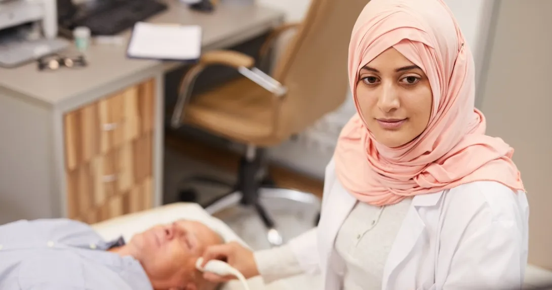Technician performing an ultrasound exam