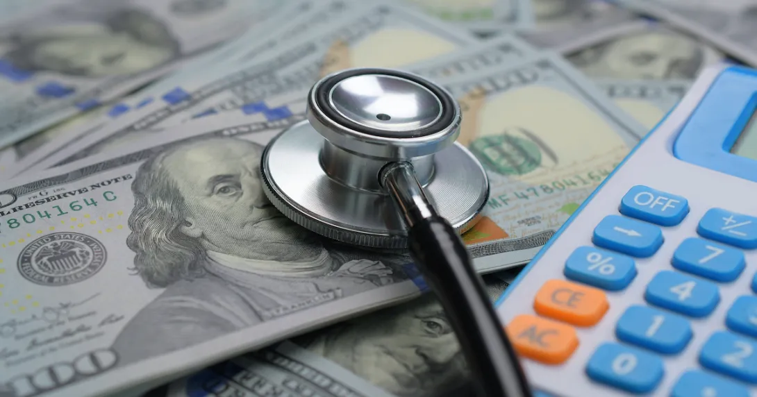 Stethoscope, money and a calculator.