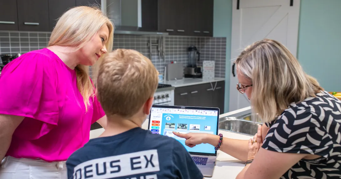 Professor Sonja March of USQ demonstrating the use of Momentum to a parent and child