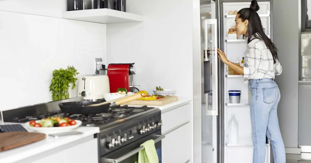 Person looking into a refrigerator
