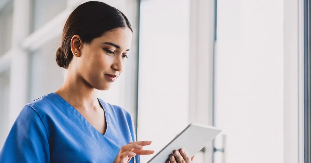 A nurse using a tablet