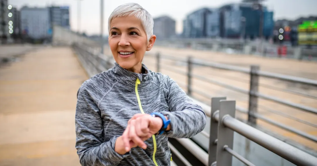 A person using a smartwatch while exercising.