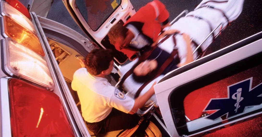 Overhead picture of emergency medical services loading a patient into an ambulance
