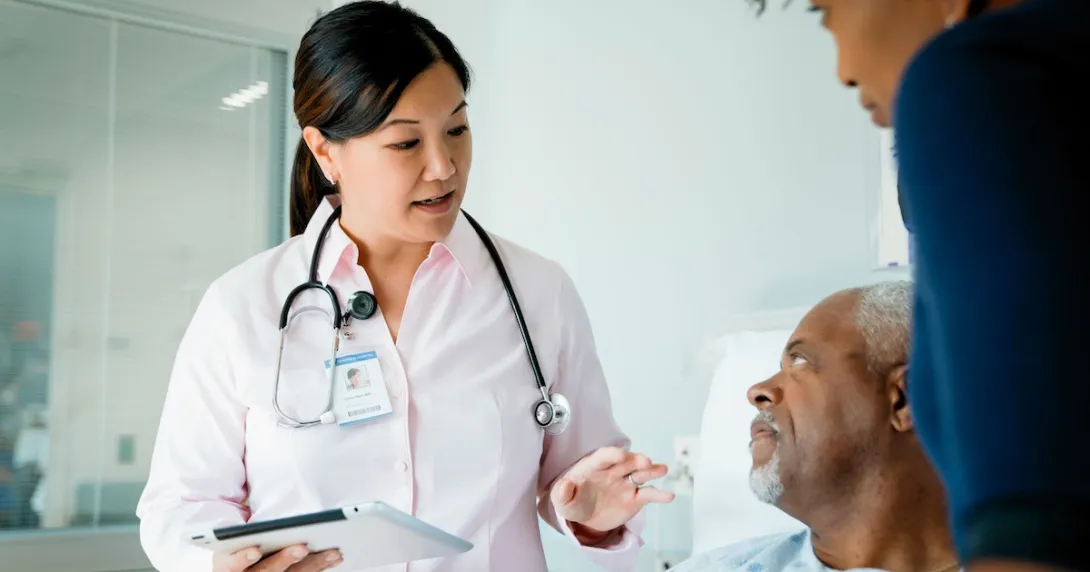 Healthcare provider with a patient and their caregiver