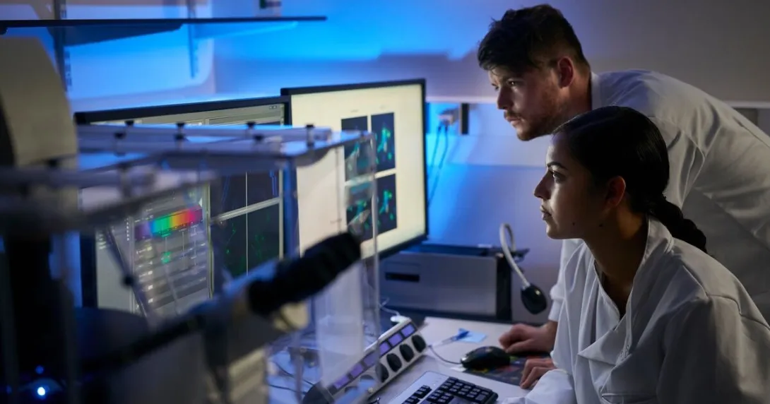 Researchers reviewing a software analysis